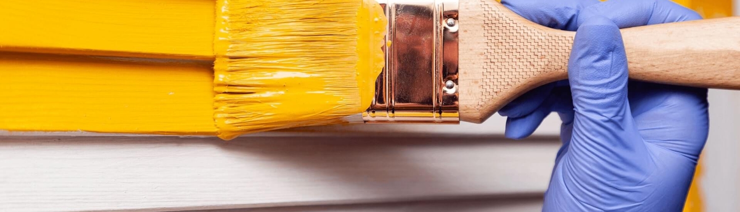 picture of a yellow wall exterior being painted